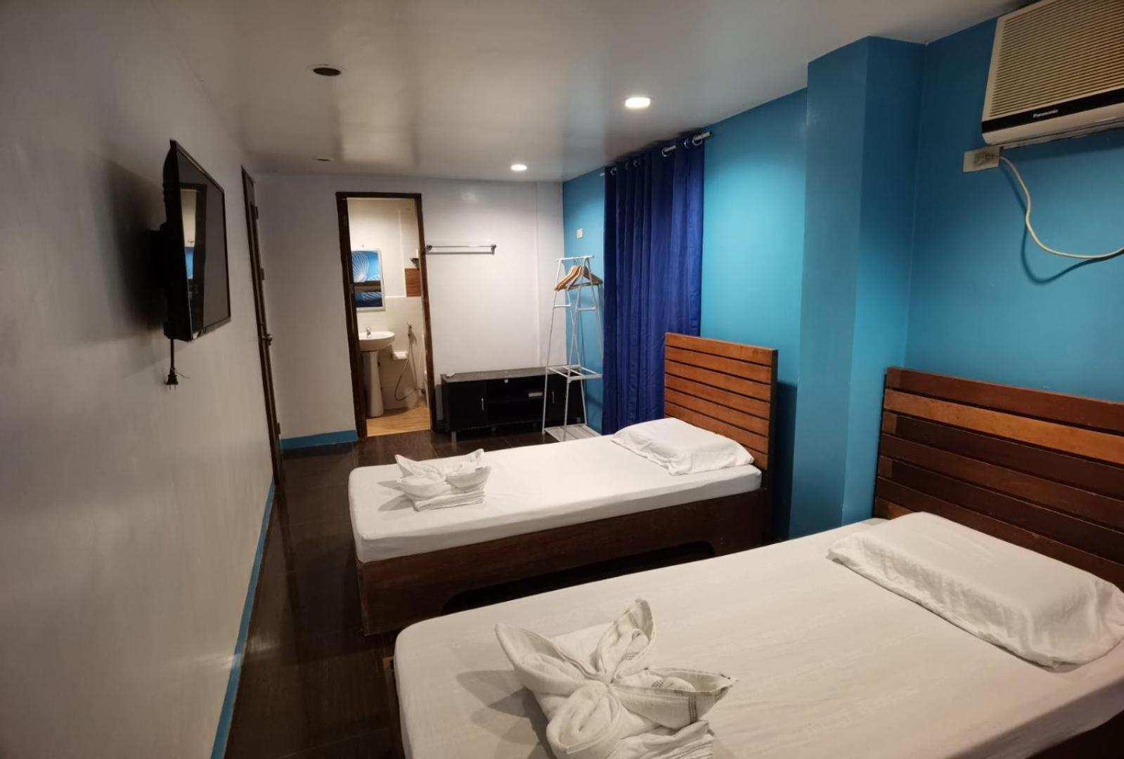 Amos Pili Tree Inn Powered By Cocotel Ель-Нідо Номер фото